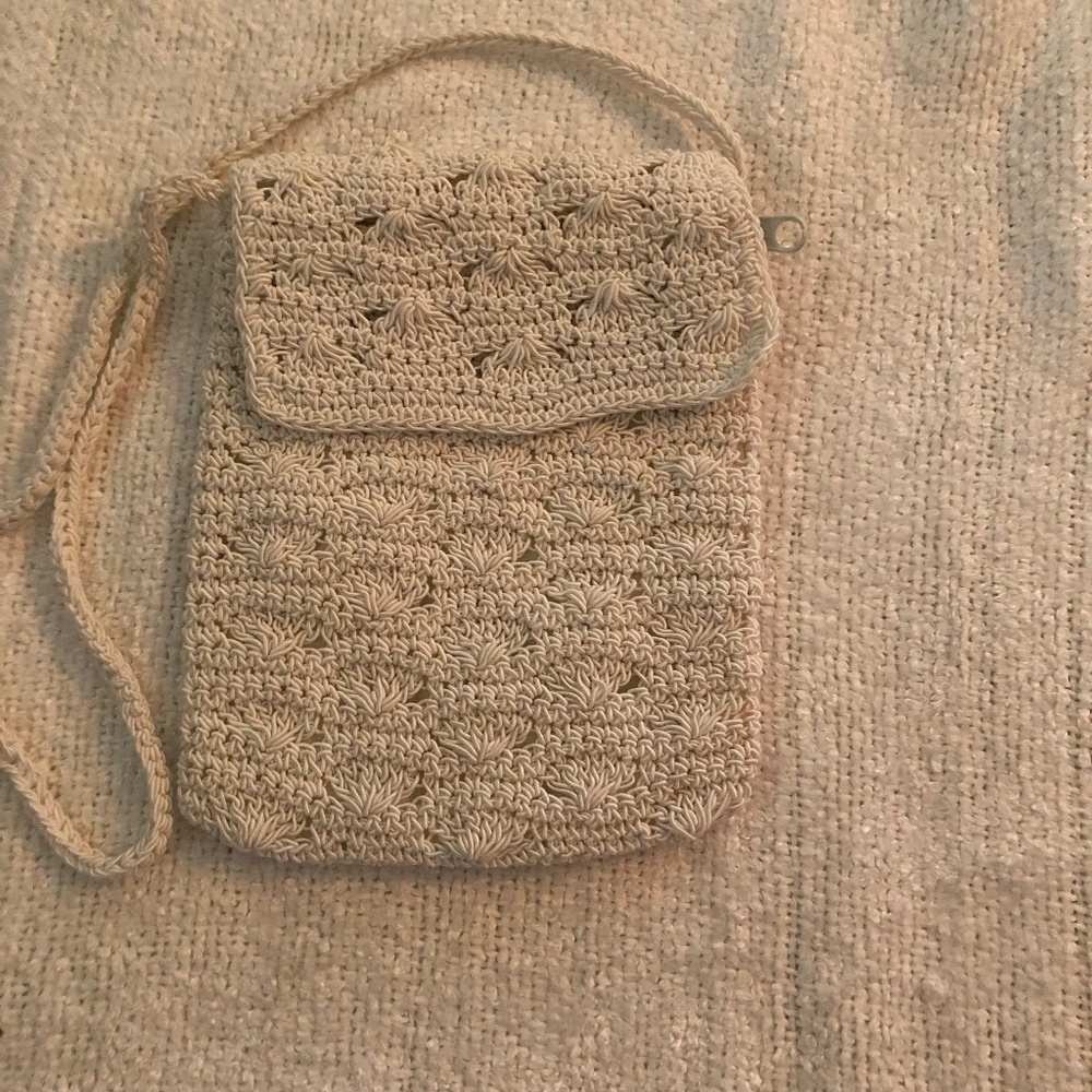 Cute little crocheted white clutch purse with zipper and crocheted handle